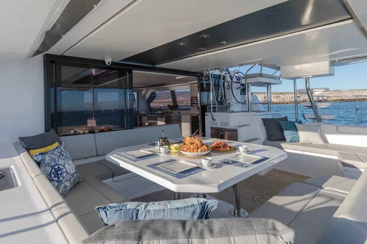 Honey Moon's shaded cockpit dining area set for guests