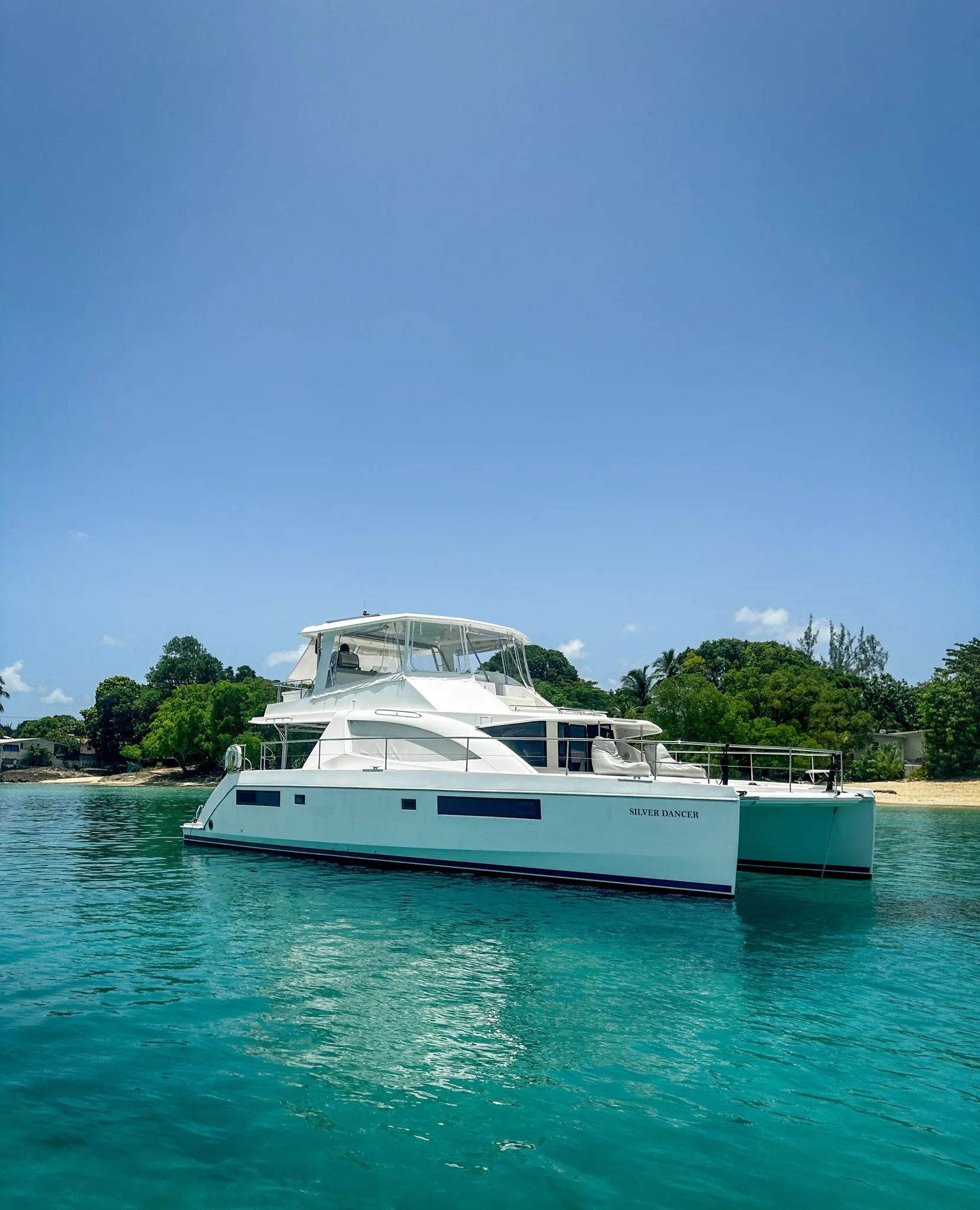 Silver Dancer at anchor with name on hull