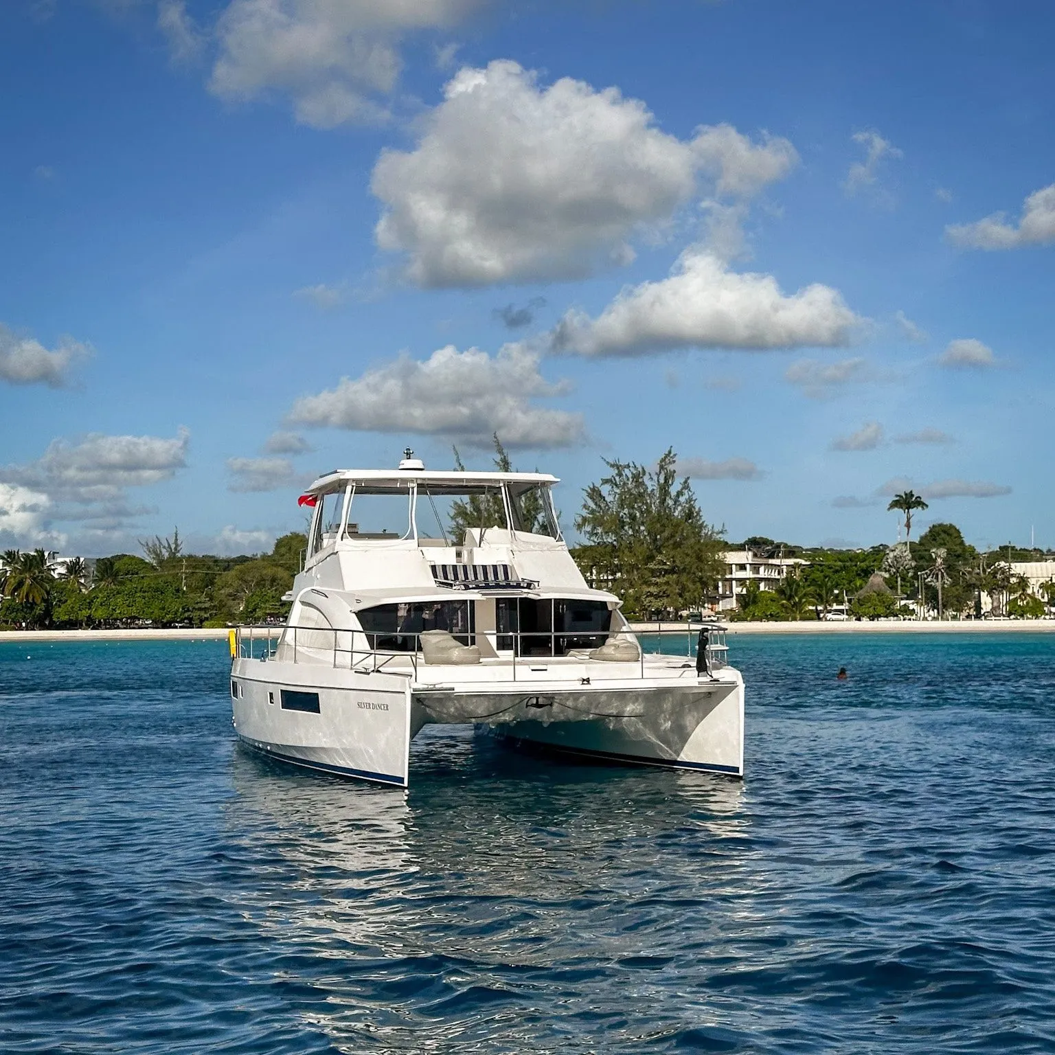 Silver Dancer from the water with guests on deck