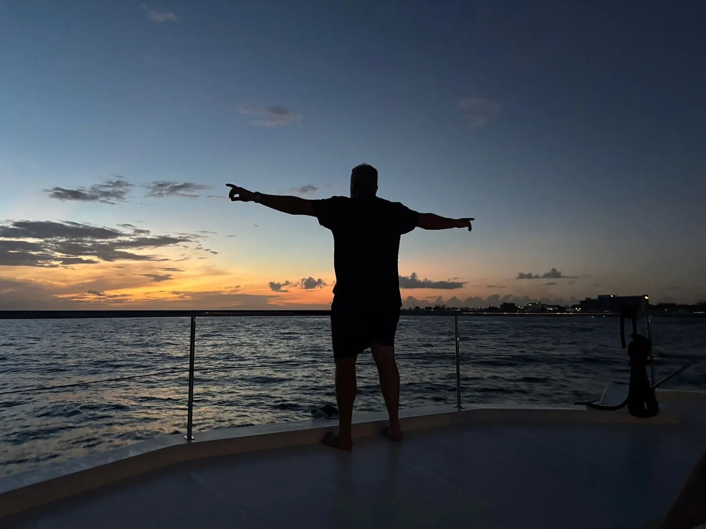 Sunset silhouette on the bow of Silver Dancer